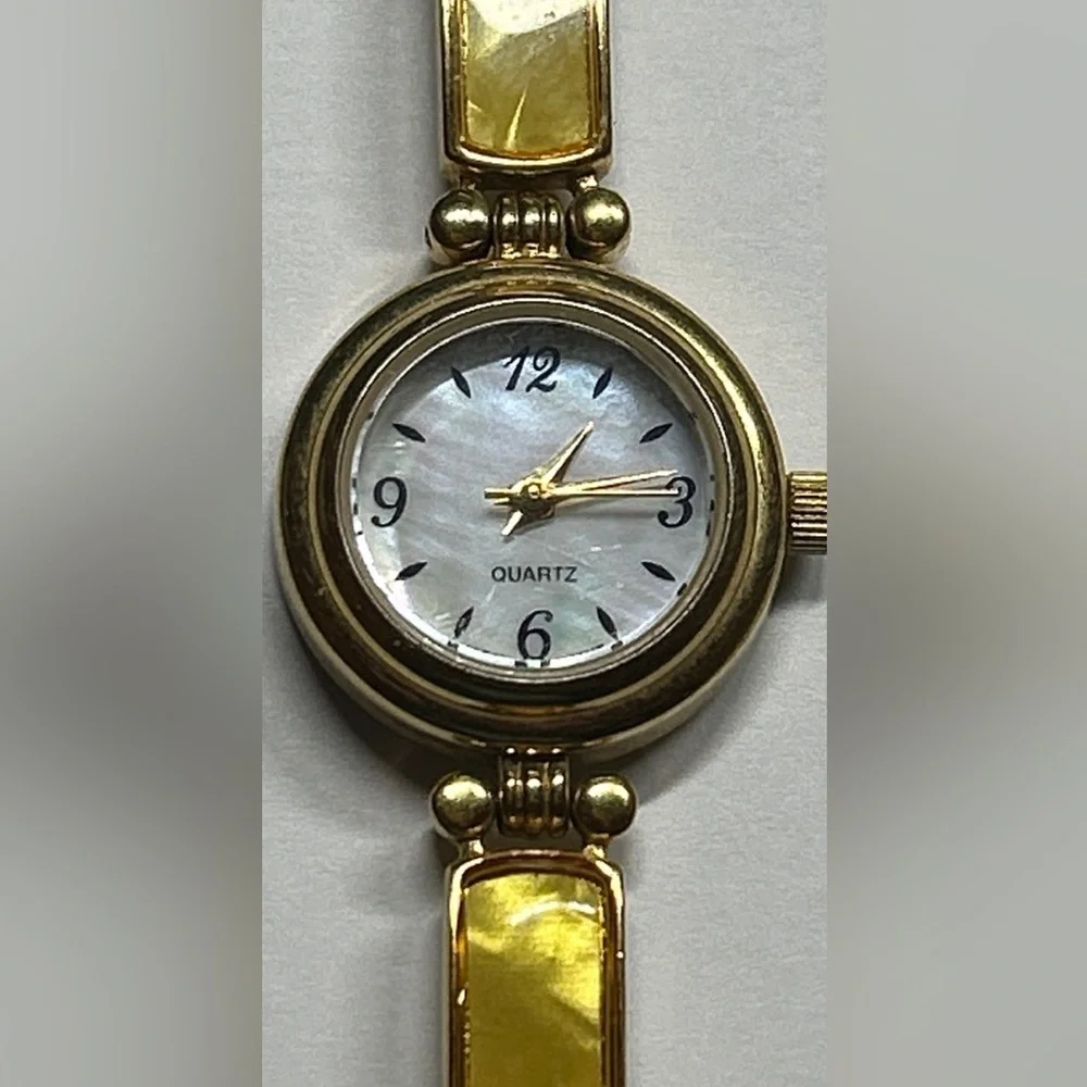 Elegant Avon Gold Tone Watch with Yellow Accents, 1
